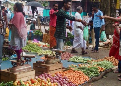 Vendeur légumes marché Vishram Inde